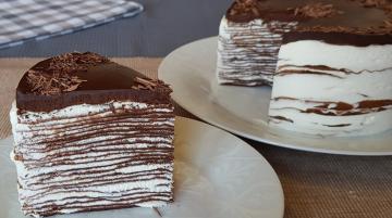 Chocolate pancake cake. The combination of gentle cream and rich chocolate glaze, gives the unique taste of the cake