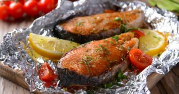 Pink salmon with vegetables baked in foil