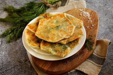 Tortillas with cheese and herbs in a pan