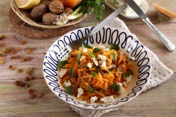 Fresh pumpkin salad with nuts and cheese