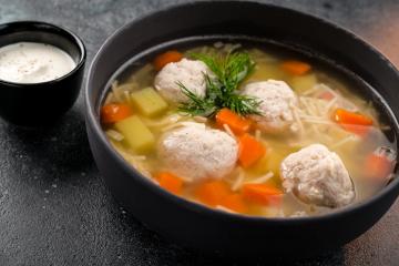 Hearty soup with meatballs and noodles