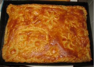 Pie with fresh cottage cheese pastry with a juicy filling of meat and cabbage