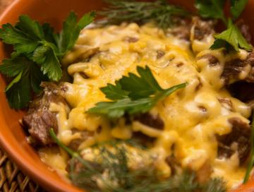 Meat with mushrooms and cheese