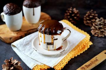 Chocolate cupcake in a mug in the microwave