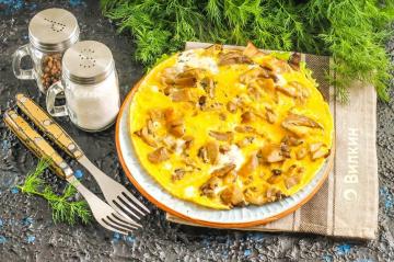 Omelet with mushrooms in a pan