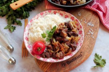 Fried beef with onions in a pan